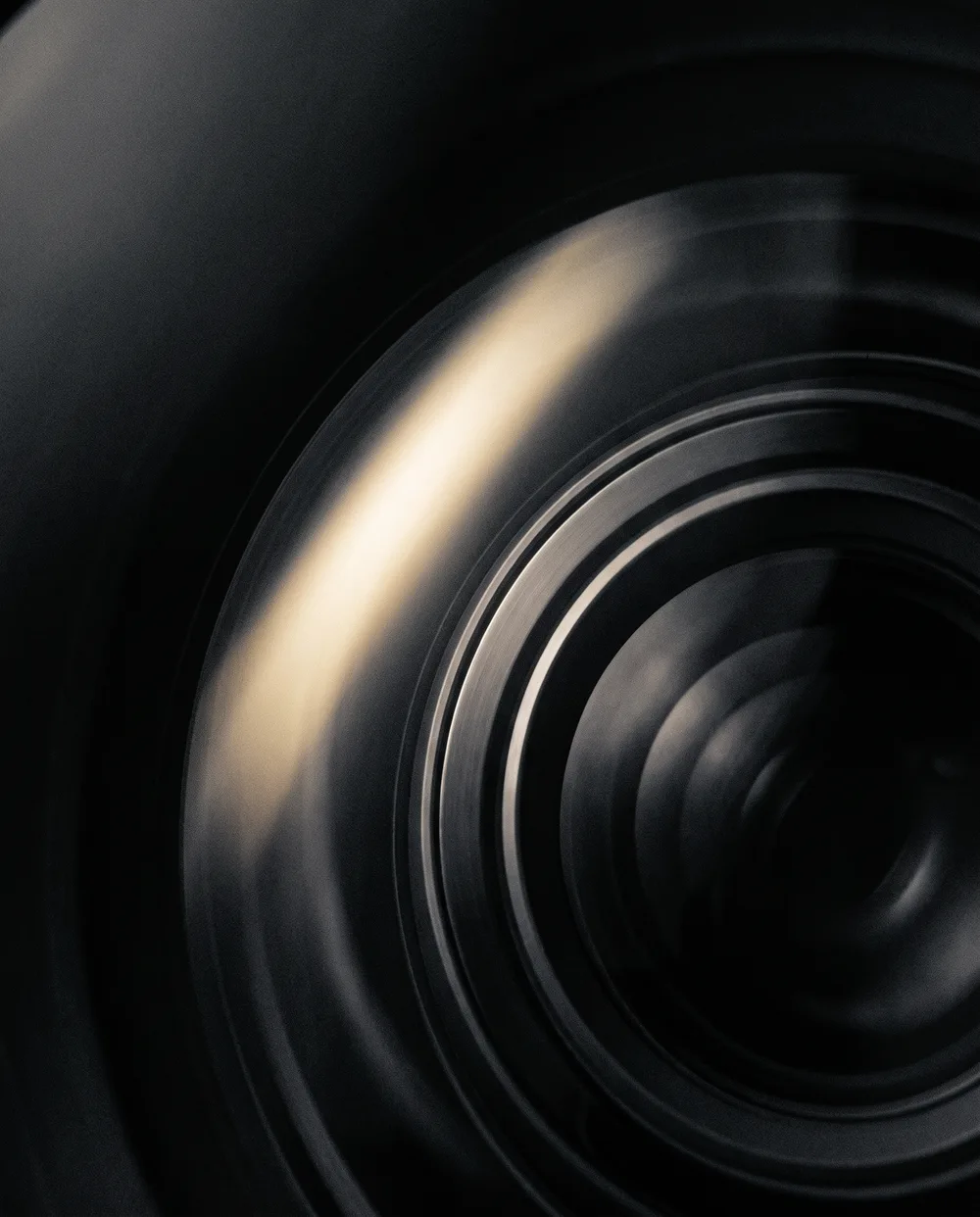 Abstract macro of a lens catching a beam of light, representing craft