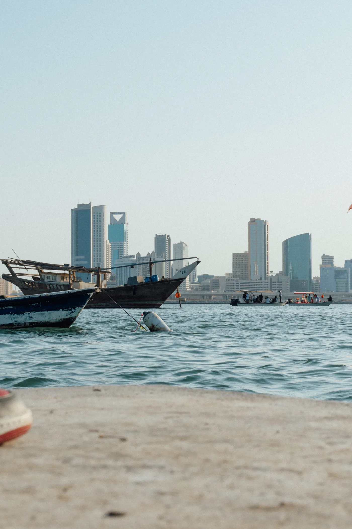 Dhow on the water against the Manama skyline during the Tmart shoot