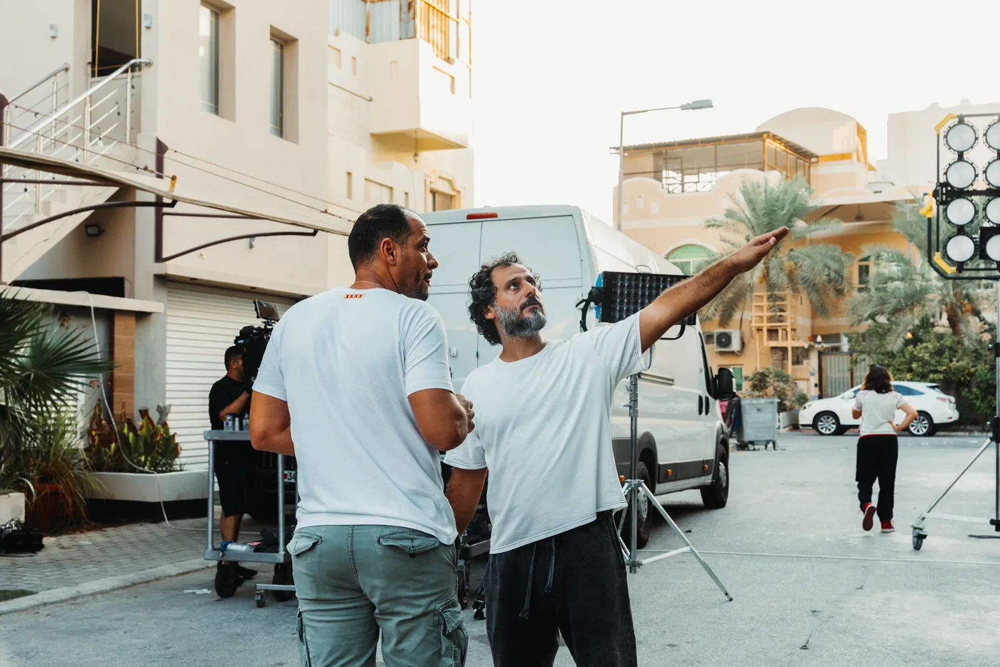 Director Omar Rammal blocking a street scene on the Tmart shoot in Bahrain