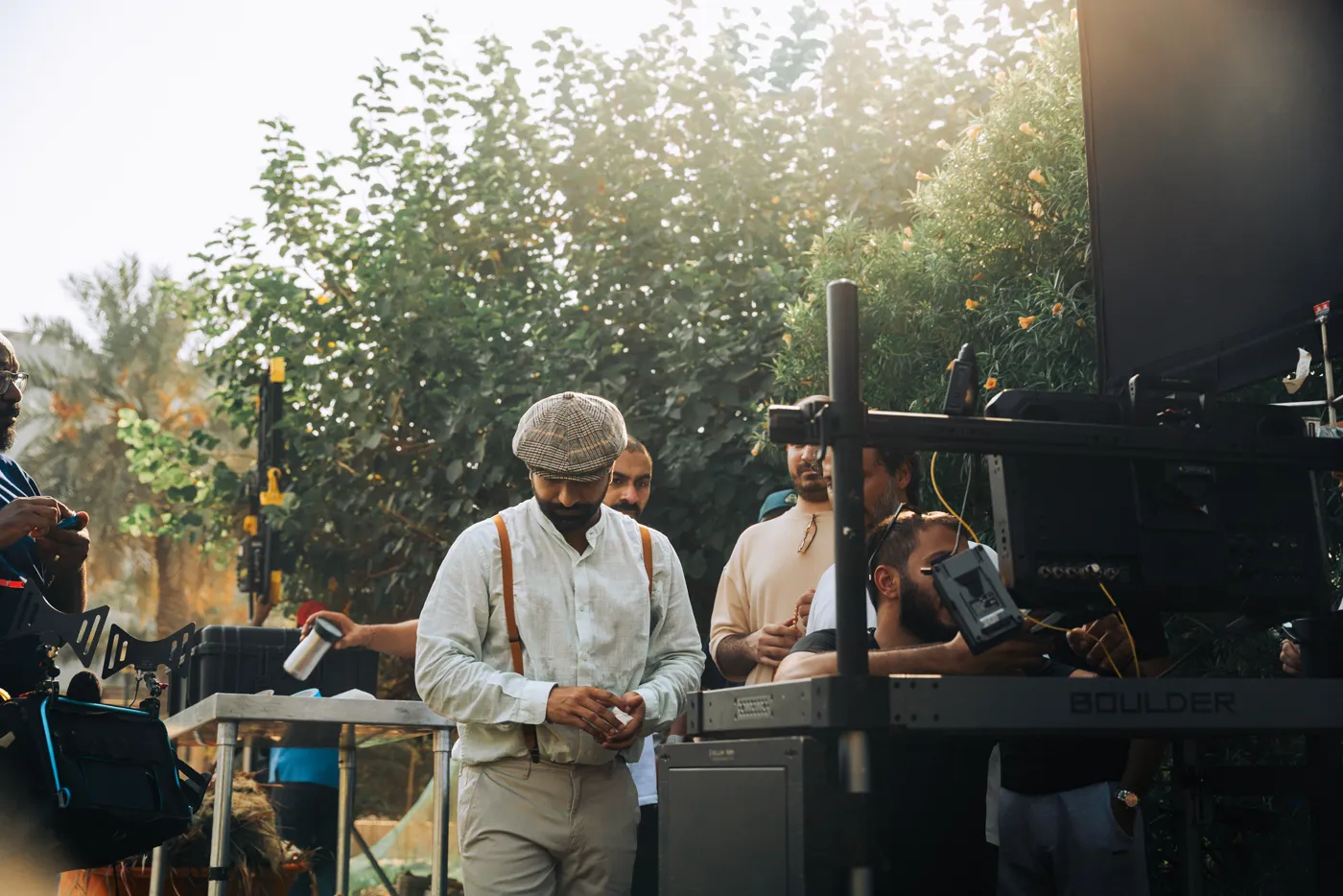 Lead actor Ahmed Sharif in costume at the director’s monitor on the Tmart set