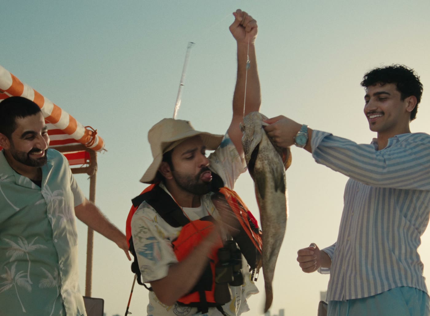 Ahmed Sharif hauling in the catch in the Tmart TVC by TCCA
